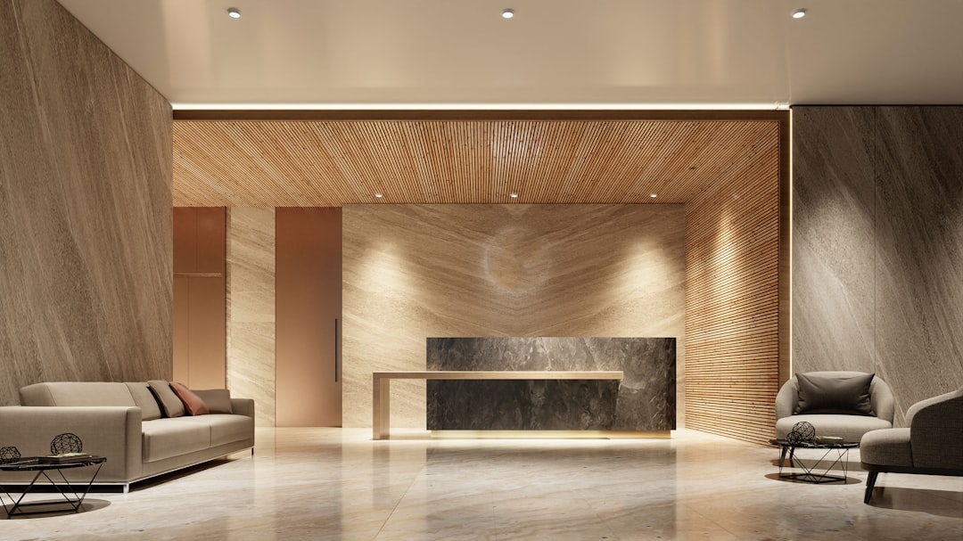 Modern Reception Lobby with Sleek Marble and Wood Elements, Contemporary Furniture, and Subtle Lighting for a Luxurious and Sophisticated Atmosphere