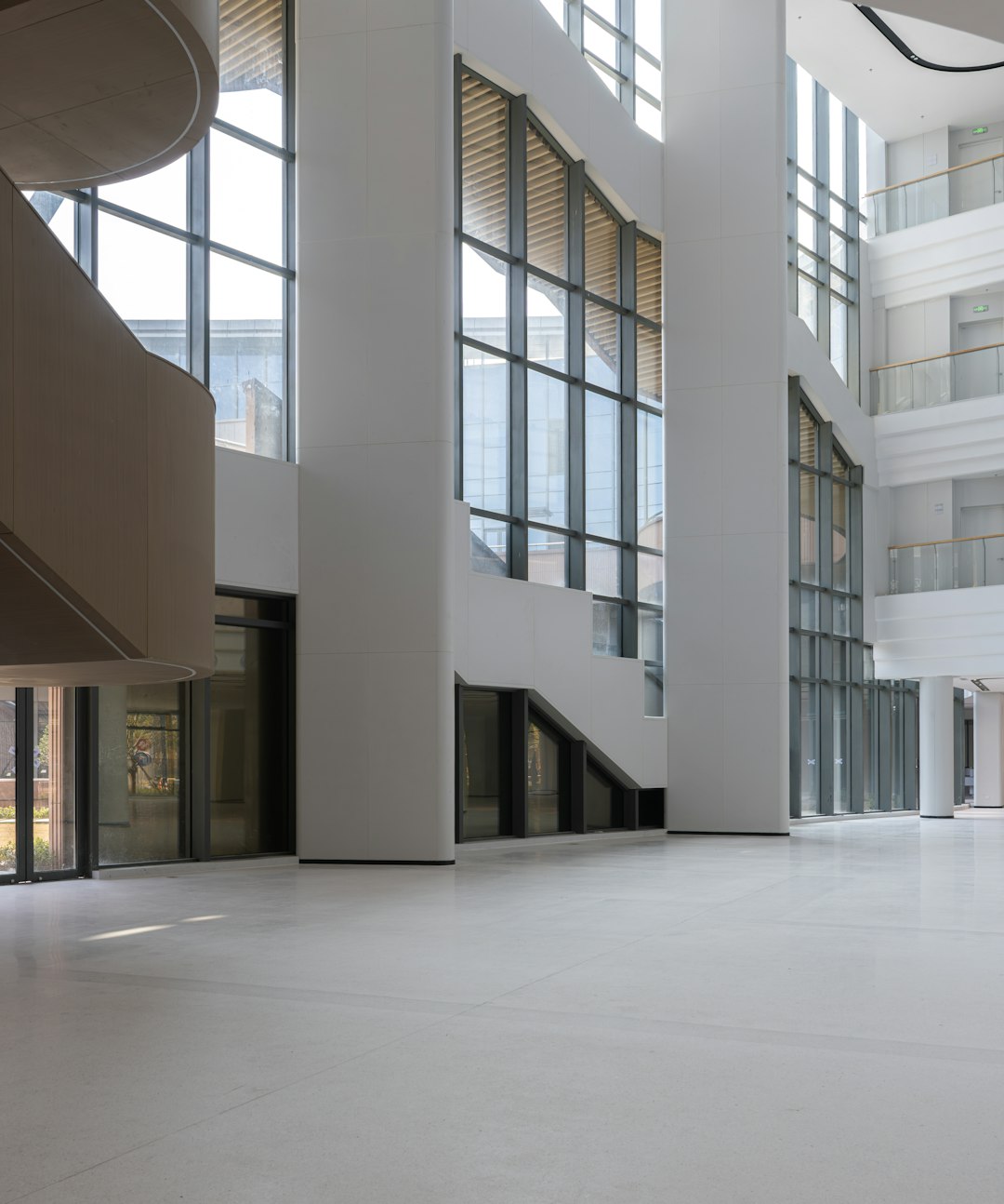 modern-building-interior-with-large-windows-and-white-walls-izr-fzenwvc